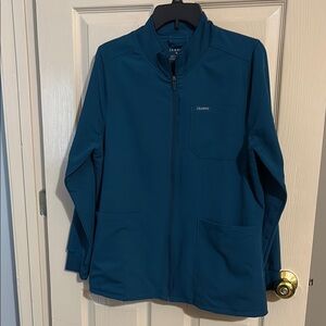 Jaanuu women’s scrubs jacket in Caribbean blue size medium.